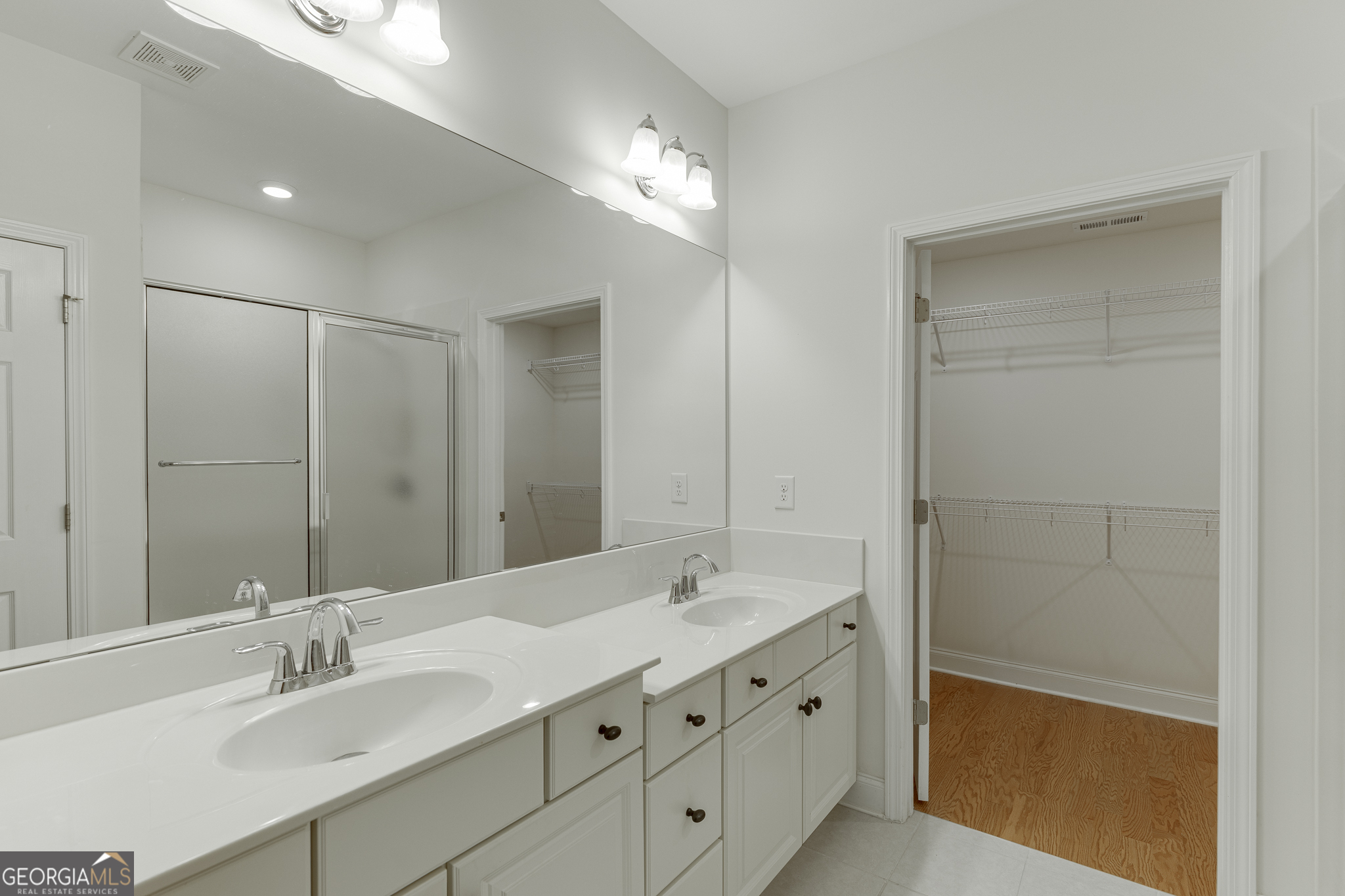 3765 Ridgehurst Drive Buford, GA 30518 - Photo 30 of 44 Primary bathroom with extended dual vanity and separate shower area.