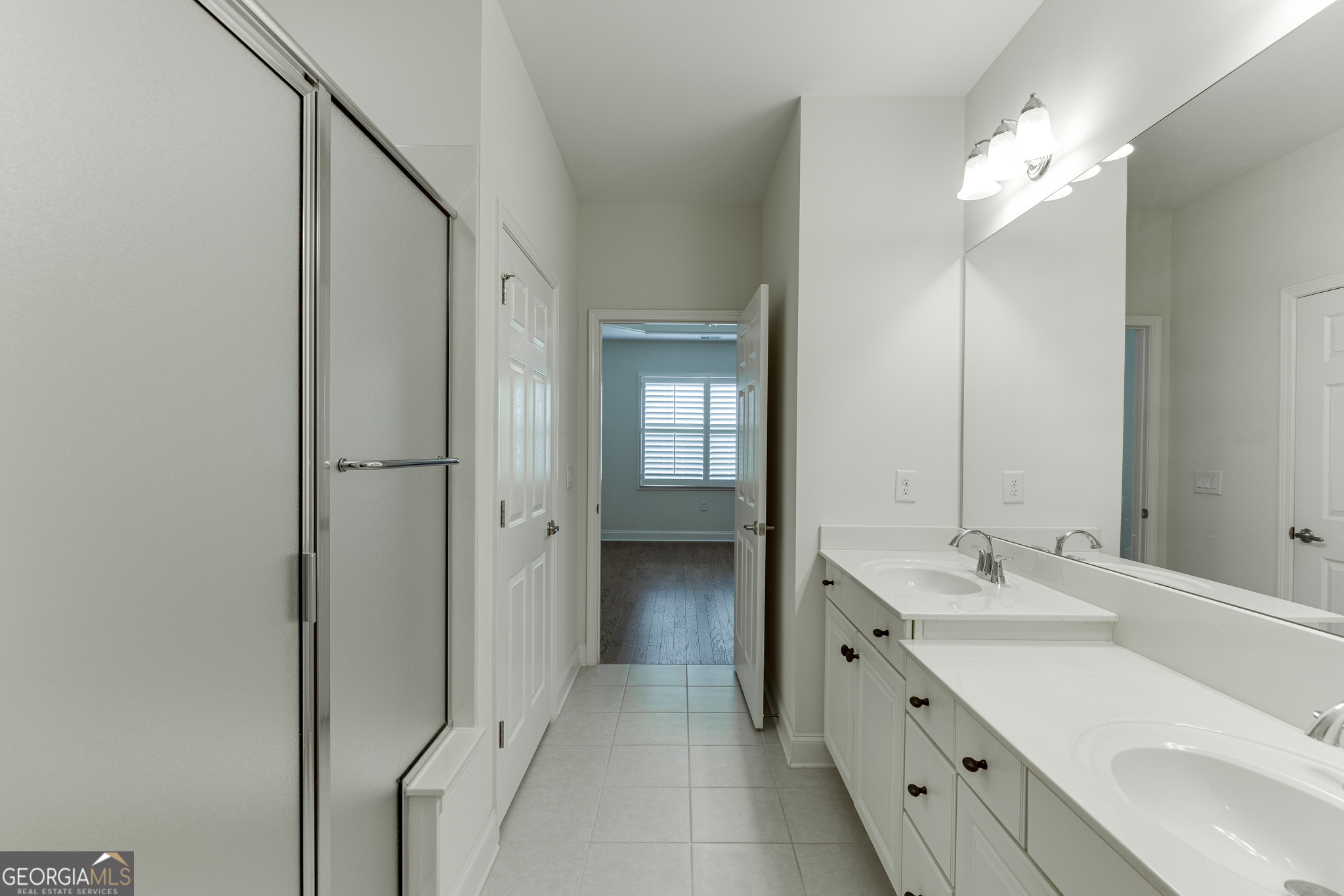 3765 Ridgehurst Drive Buford, GA 30518 - Photo 31 of 44 Additional primary bathroom view with hall access and functional layout.