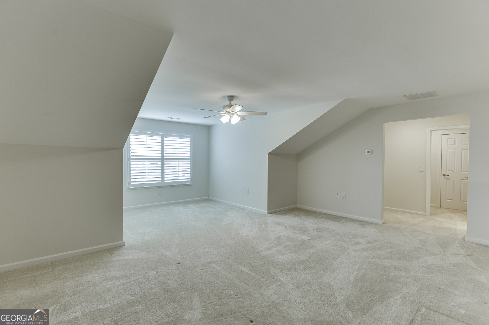 3765 Ridgehurst Drive Buford, GA 30518 - Photo 34 of 44 Finished upper-level bonus space with carpet and versatile layout.
