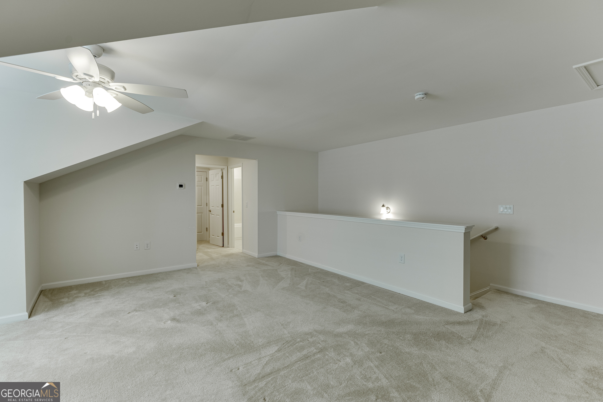 3765 Ridgehurst Drive Buford, GA 30518 - Photo 35 of 44 Additional bonus room view with open railing and flexible use potential.