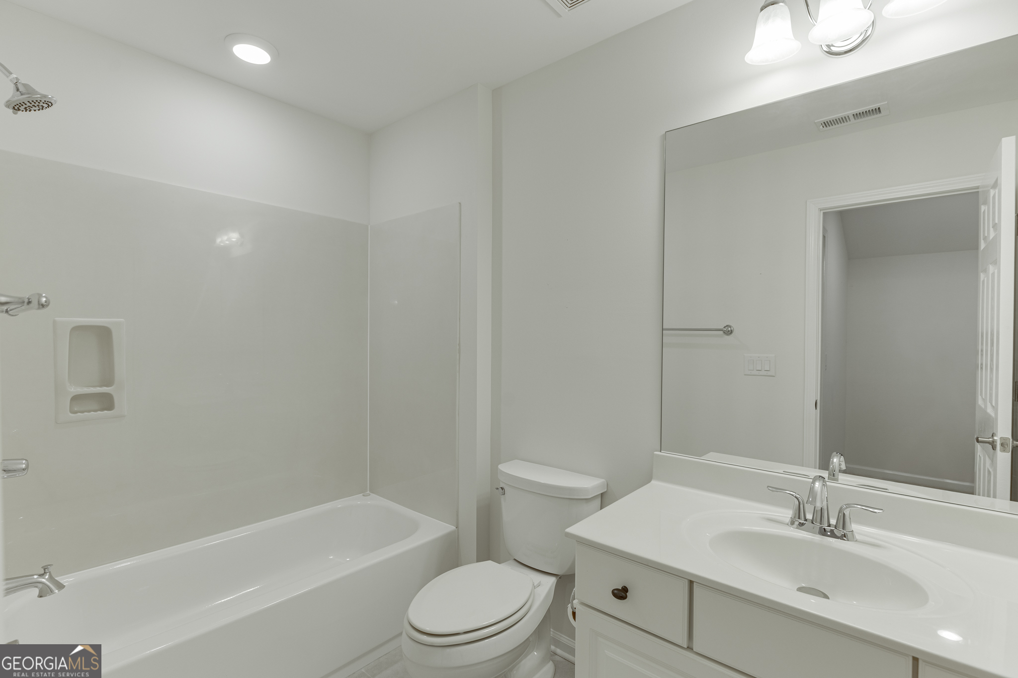 3765 Ridgehurst Drive Buford, GA 30518 - Photo 37 of 44 Full bathroom with vanity and tub/shower combination.