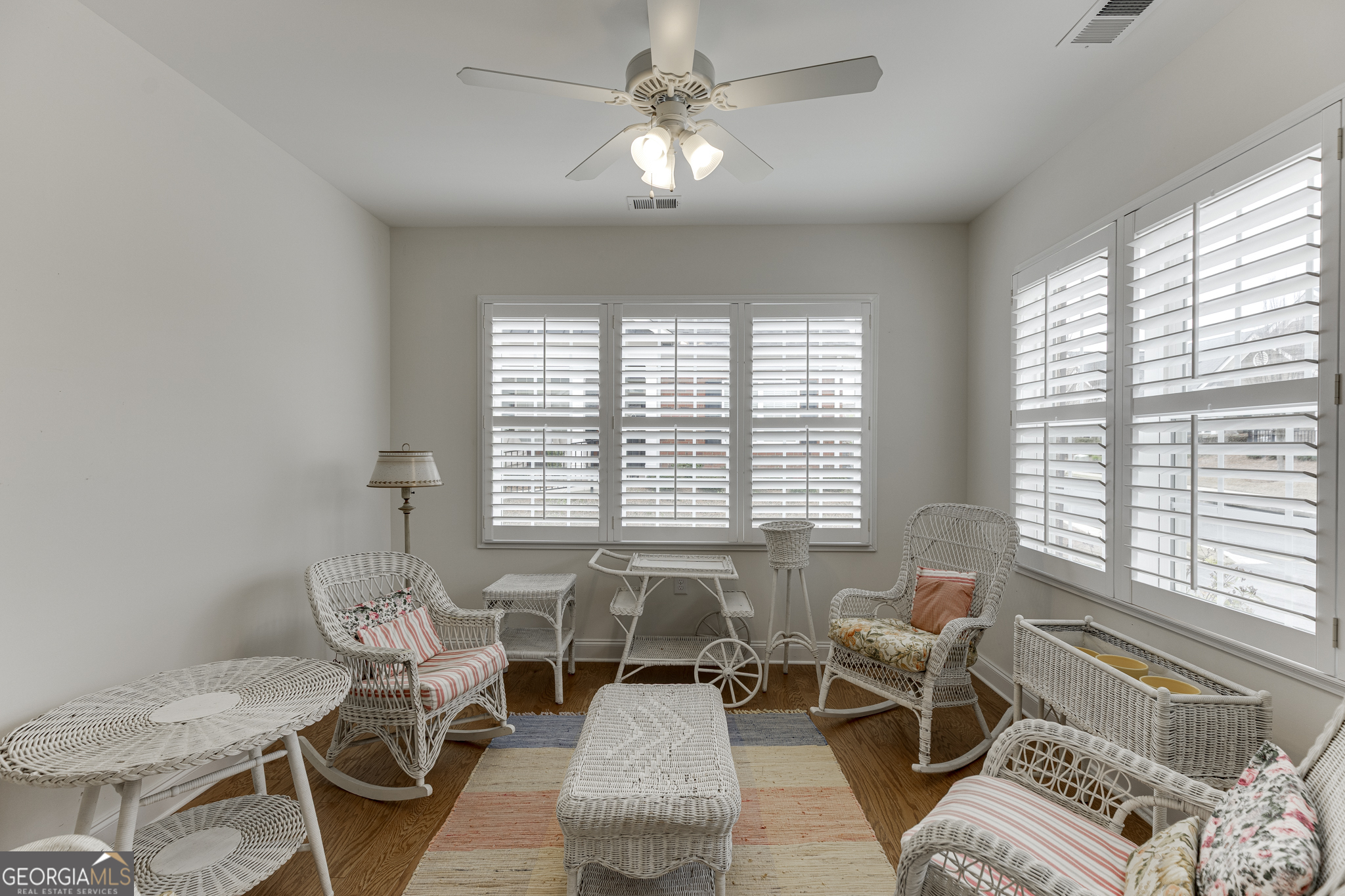 3765 Ridgehurst Drive Buford, GA 30518 - Photo 5 of 44 Bright sunroom with abundant windows and a comfortable sitting area.