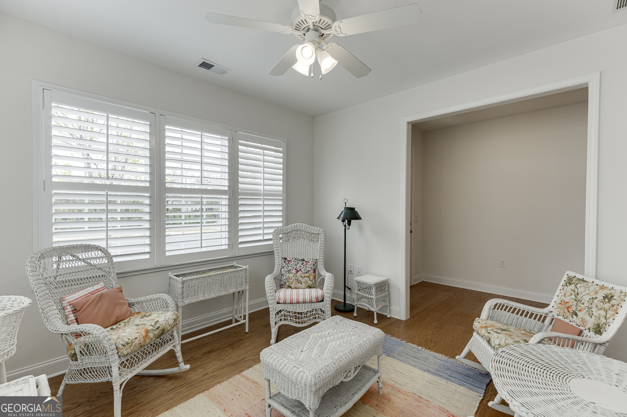 3765 Ridgehurst Drive Buford, GA 30518 - Photo 6 of 44 Light-filled sunroom with plantation shutters and relaxing views.
