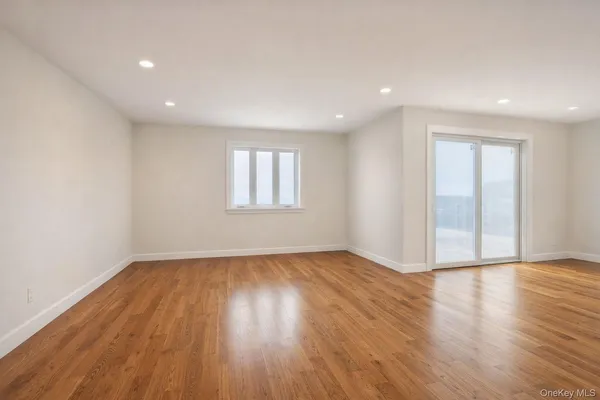 a view of a room with wooden walls