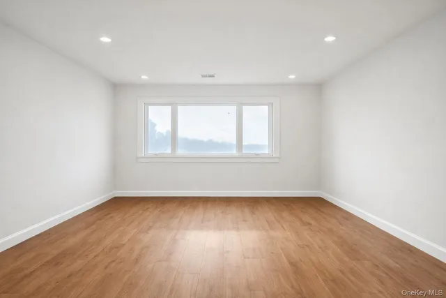 a view of an empty room with stairs