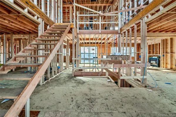 a view of an empty room with wooden walls