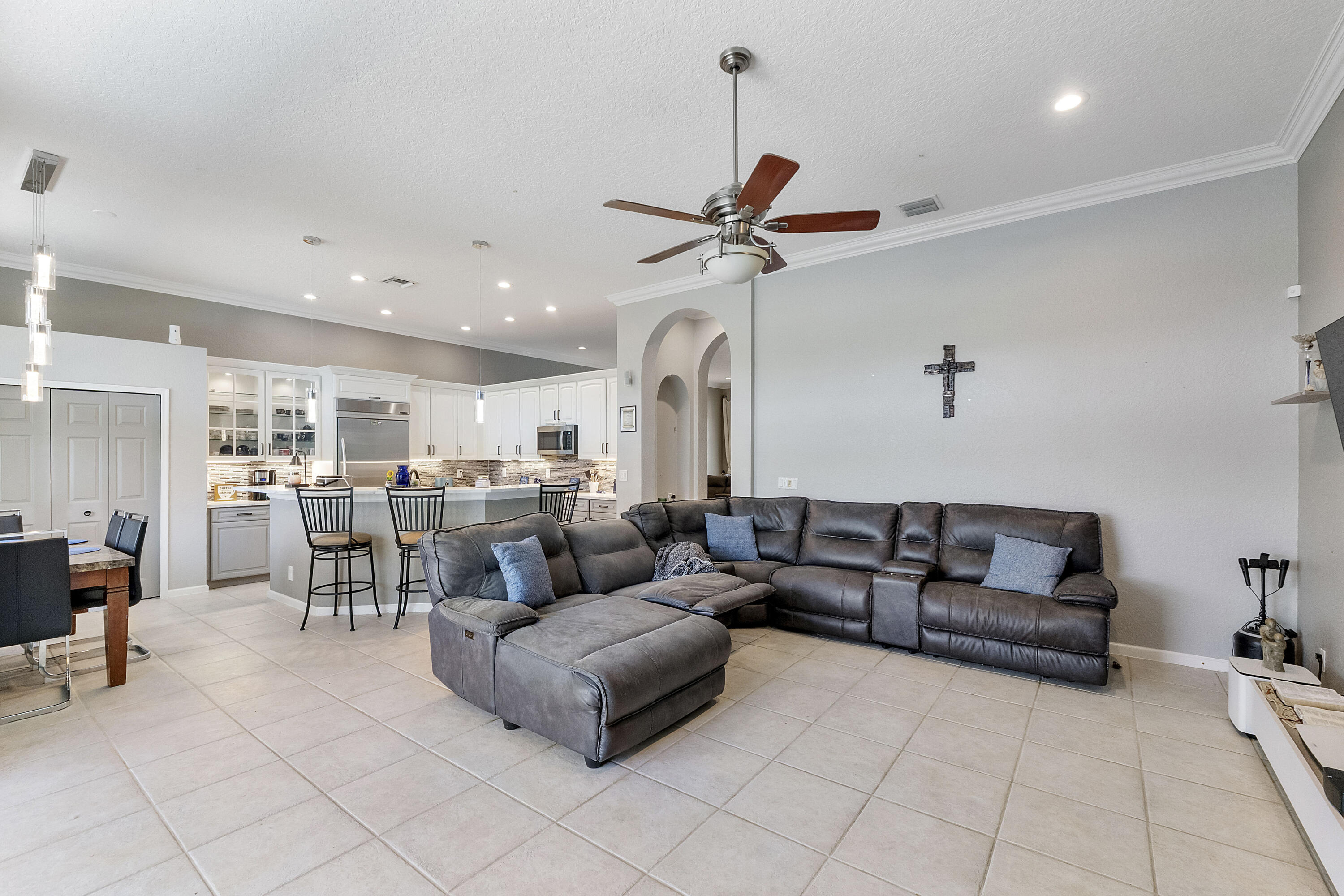 12328 St Simon Drive Boca Raton, FL 33428 - Photo 17 of 52 a living room with furniture a ceiling fan and a rug