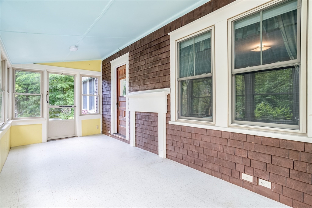 123 Pepperell Road Groton, MA 01450 - Photo 34 of 42 a view of an empty room with a fireplace and a window