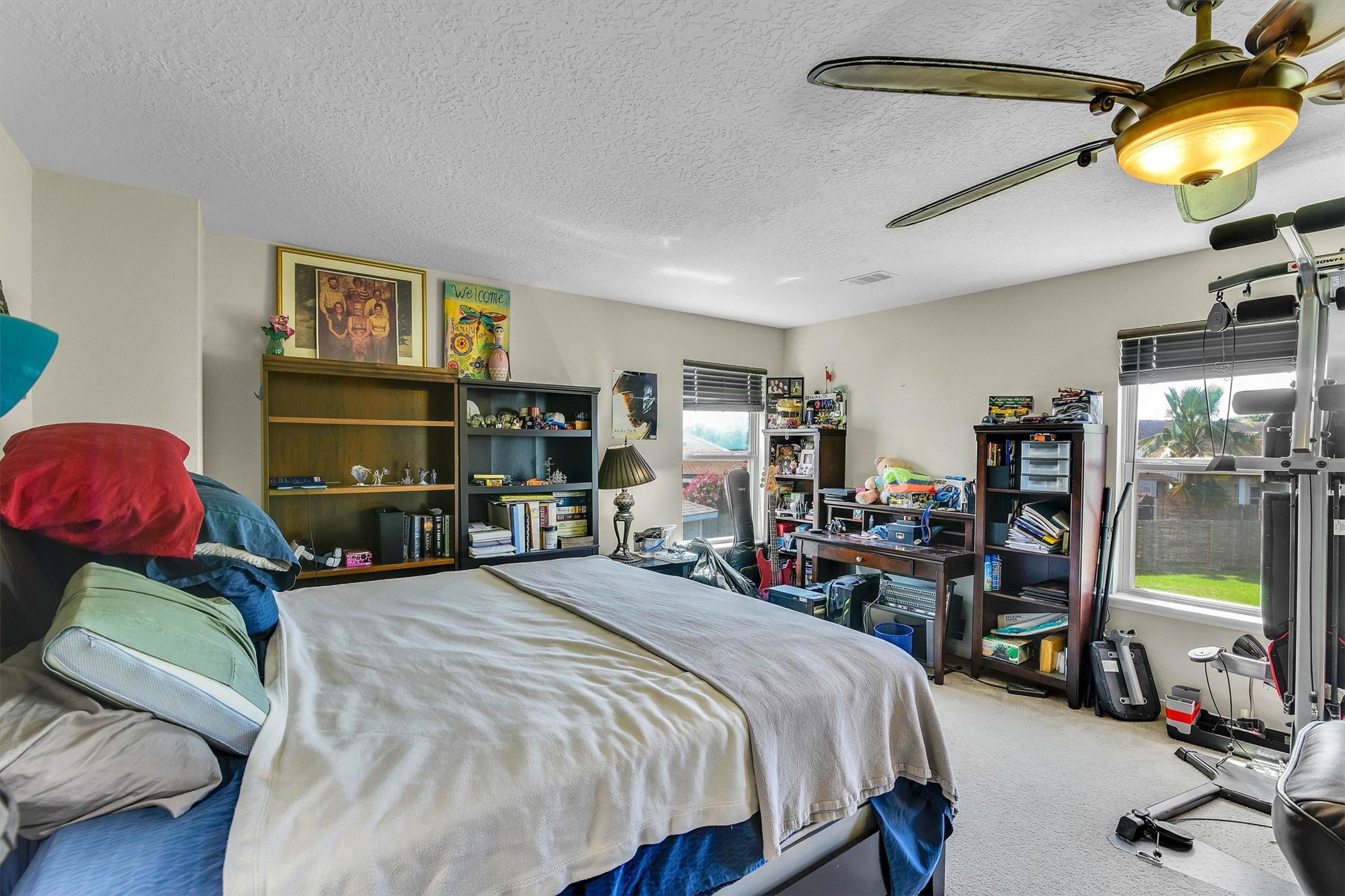 3003 Legends York Drive Spring, TX 77386 - Photo 18 of 29 a bedroom with bed and a flat tv screen on the dresser