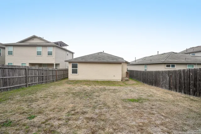 a view of backyard of house