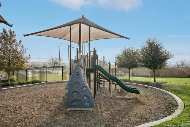 a view of a park with a slide