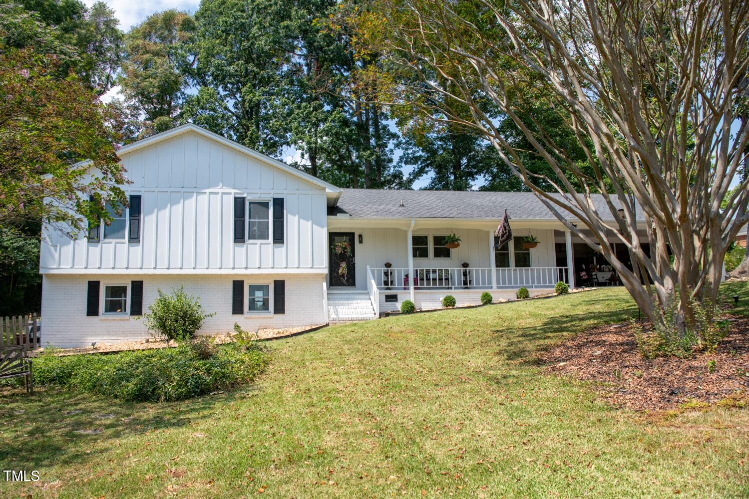 222 Gardiner Road Asheboro, NC 27203 - Photo 1 of 32 a view of a house with a yard and sitting area
