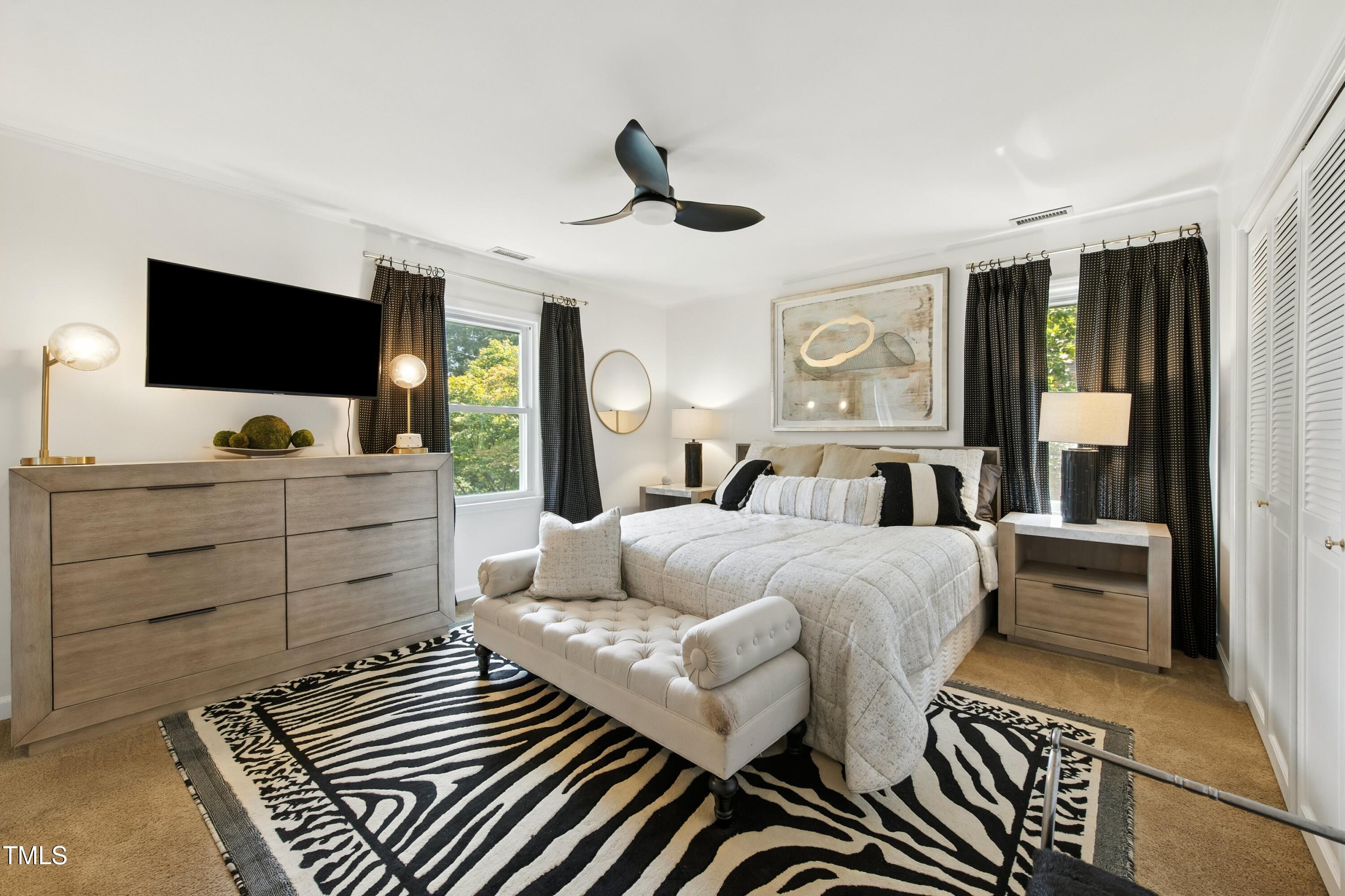 222 Gardiner Road Asheboro, NC 27203 - Photo 14 of 32 a bedroom with a bed and a flat screen tv