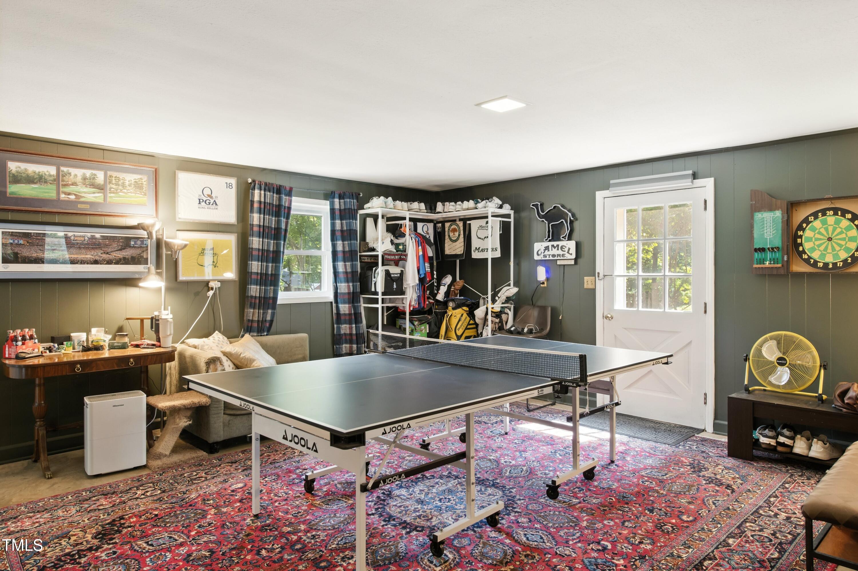 222 Gardiner Road Asheboro, NC 27203 - Photo 23 of 32 a living room with furniture a flat screen tv and a table