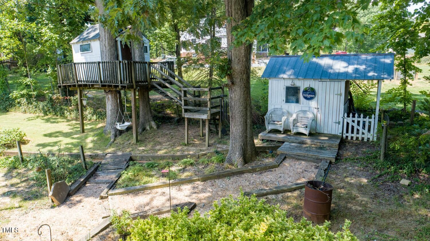222 Gardiner Road Asheboro, NC 27203 - Photo 27 of 32 a view of a chair and table in backyard