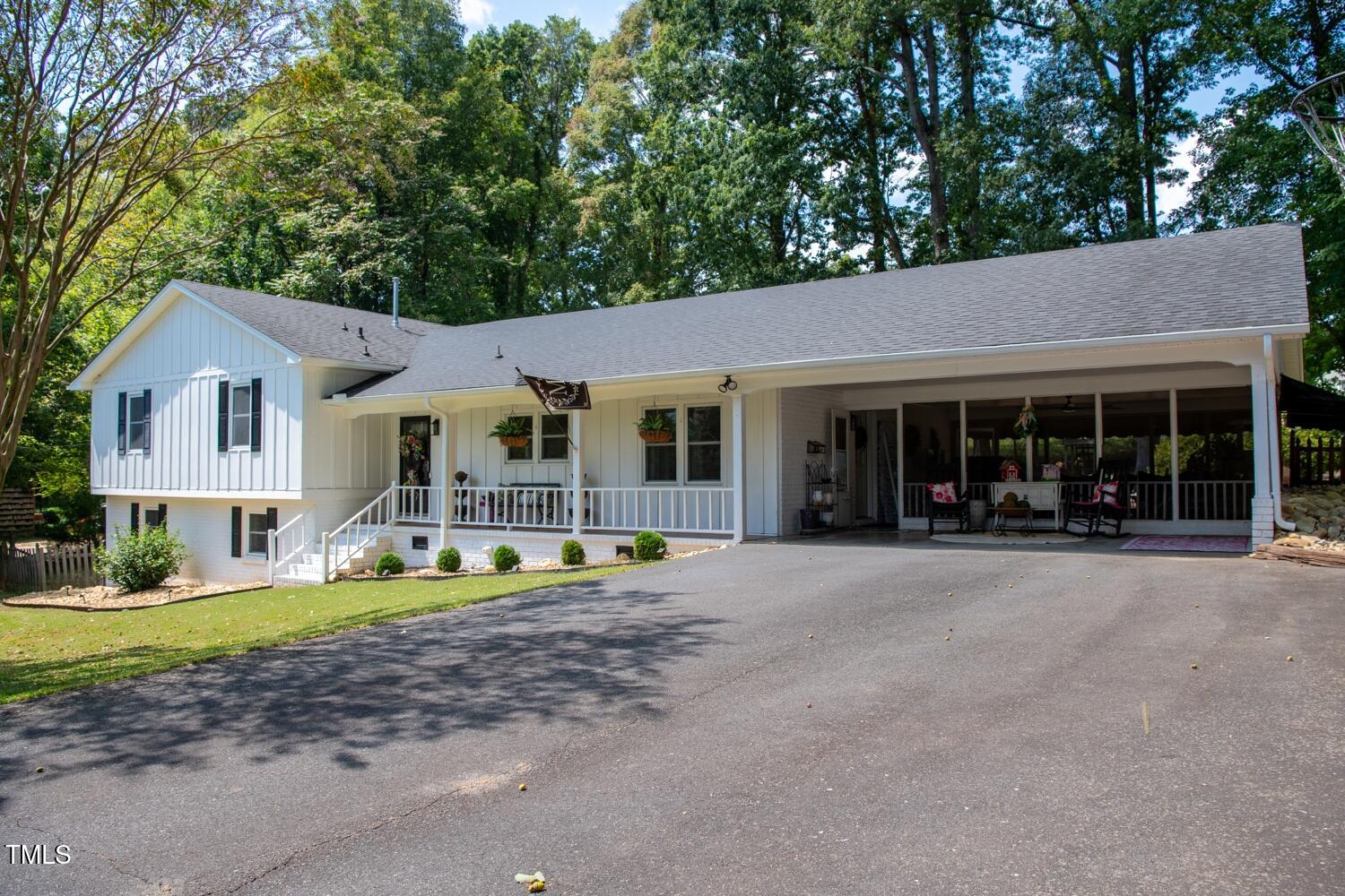 222 Gardiner Road Asheboro, NC 27203 - Photo 2 of 32 a front view of a house with garden and trees