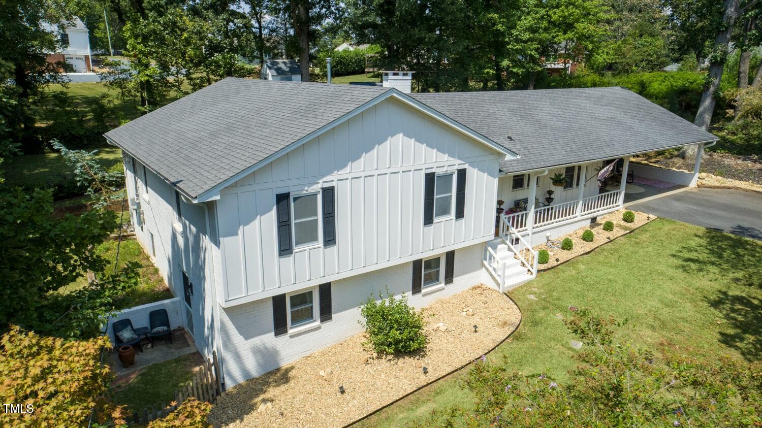 222 Gardiner Road Asheboro, NC 27203 - Photo 3 of 32 a aerial view of a house next to a yard with large trees