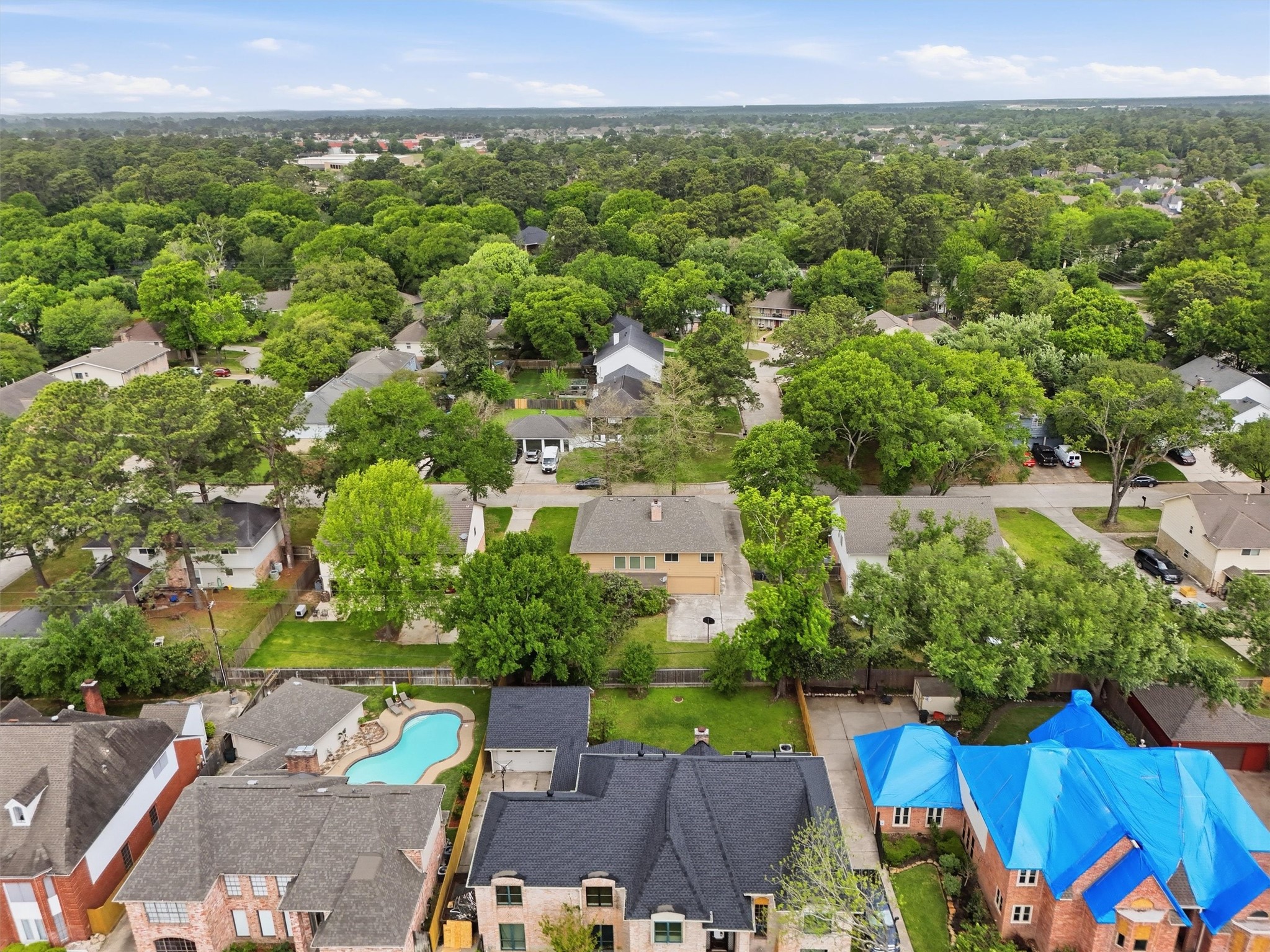 8115 Theisswood Road Spring, TX 77379 - Photo 35 of 36 an aerial view of a house with a yard
