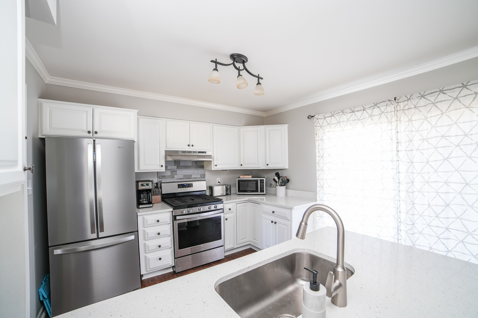 281 Kathy Drive Bourbonnais, IL 60914 - Photo 13 of 43 a kitchen with stainless steel appliances kitchen island a refrigerator sink and cabinets