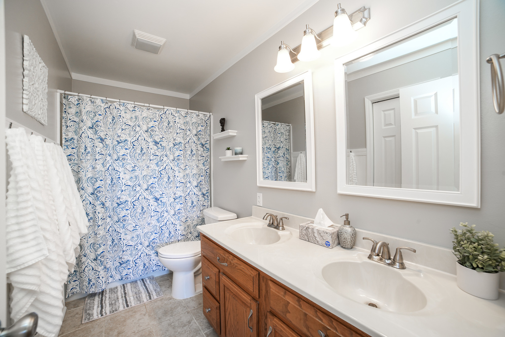 281 Kathy Drive Bourbonnais, IL 60914 - Photo 20 of 43 a bathroom with a sink toilet a mirror a vanity and shower