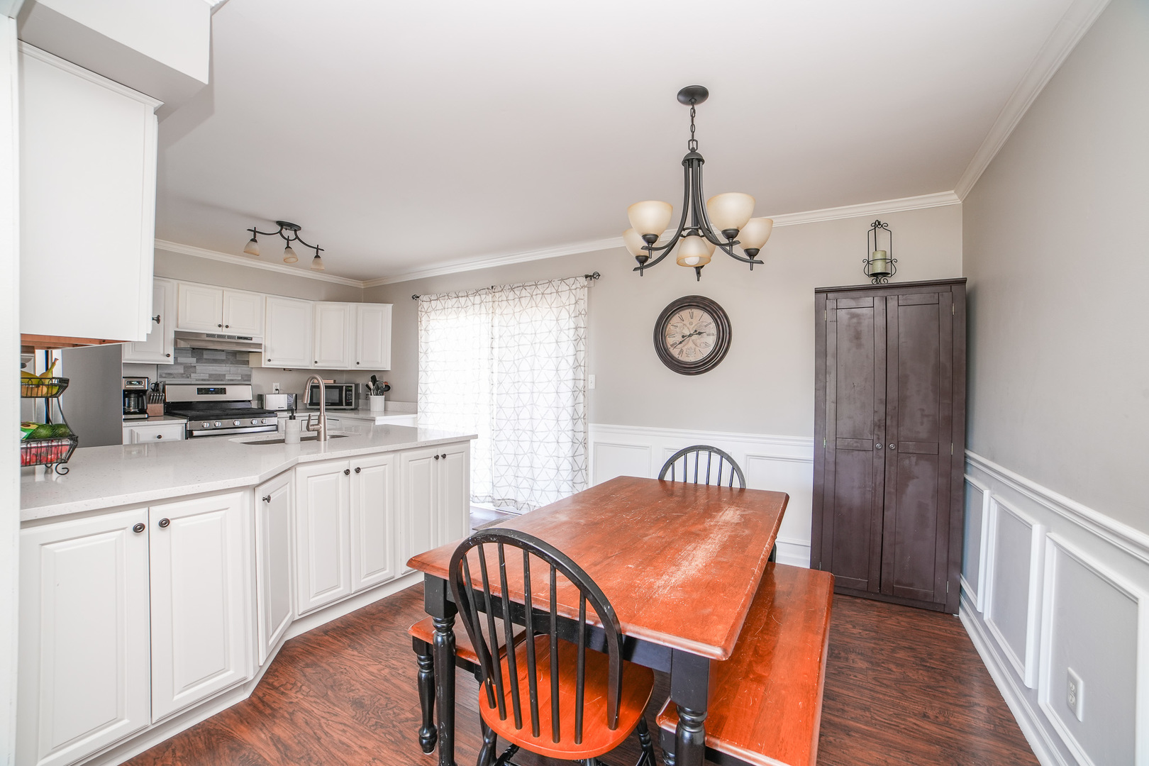 281 Kathy Drive Bourbonnais, IL 60914 - Photo 9 of 43 a kitchen with stainless steel appliances granite countertop a refrigerator a stove a sink dishwasher and white cabinets with wooden floor