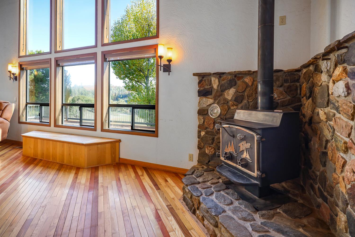 6612 Michel Road Mountain Ranch, CA 95246 - Photo 12 of 78 a living room with a fireplace furniture and a large window