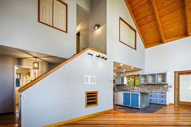 a kitchen with granite countertop a sink and a stove