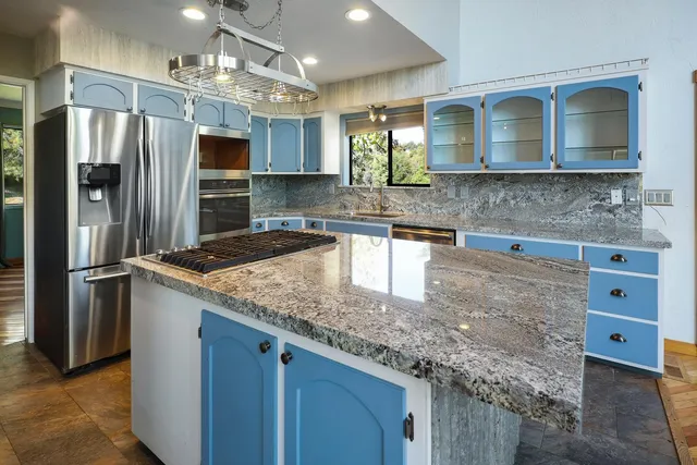 a view of a livingroom with wooden floor and a window