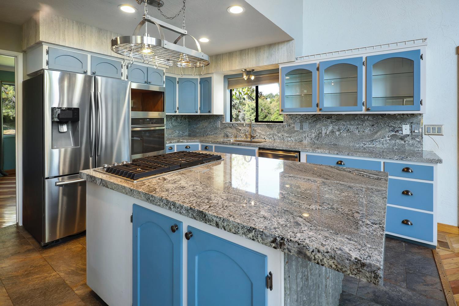6612 Michel Road Mountain Ranch, CA 95246 - Photo 17 of 78 a kitchen with stainless steel appliances granite countertop a sink and a refrigerator