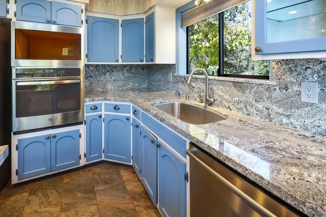 a bathroom with a bathtub sink and mirror