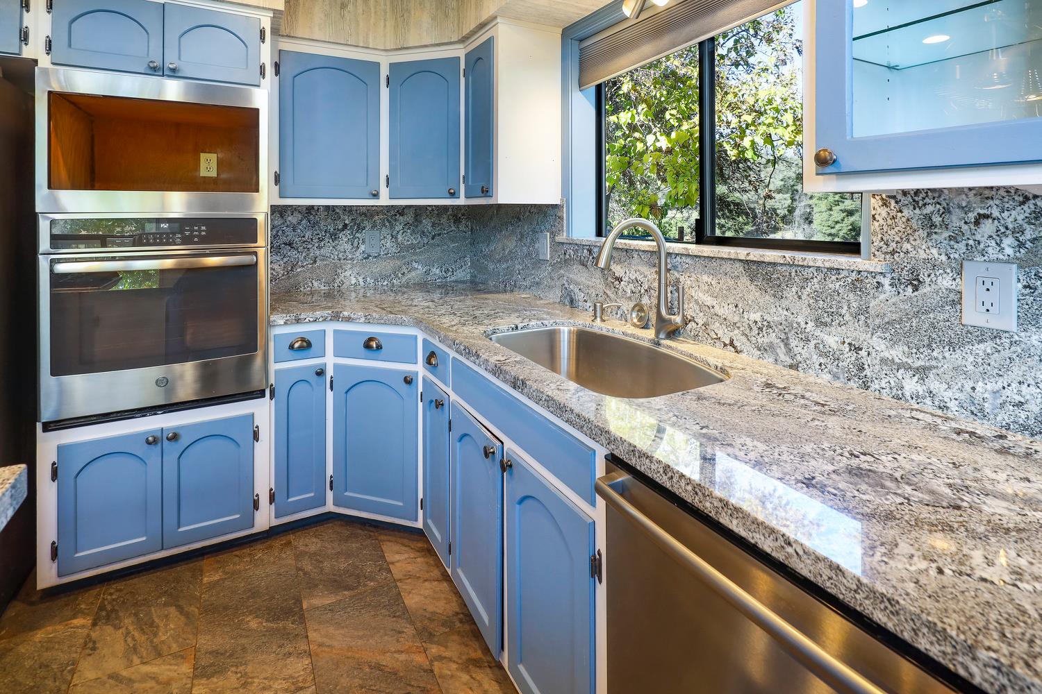 6612 Michel Road Mountain Ranch, CA 95246 - Photo 19 of 78 a kitchen with granite countertop a sink and a stove
