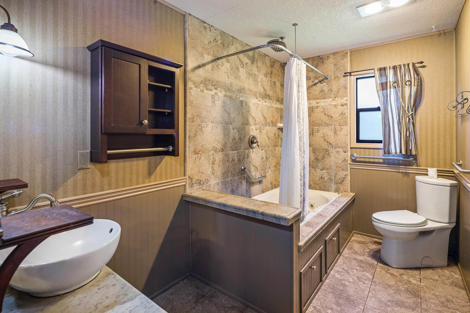 6612 Michel Road Mountain Ranch, CA 95246 - Photo 25 of 78 a bathroom with a toilet sink and shower