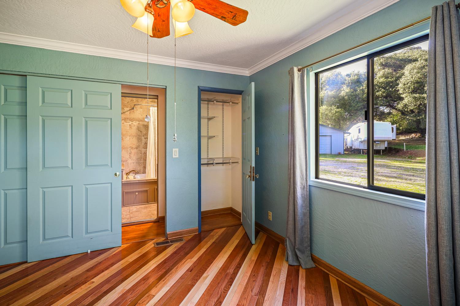 6612 Michel Road Mountain Ranch, CA 95246 - Photo 27 of 78 a view of empty room with wooden floor and fan