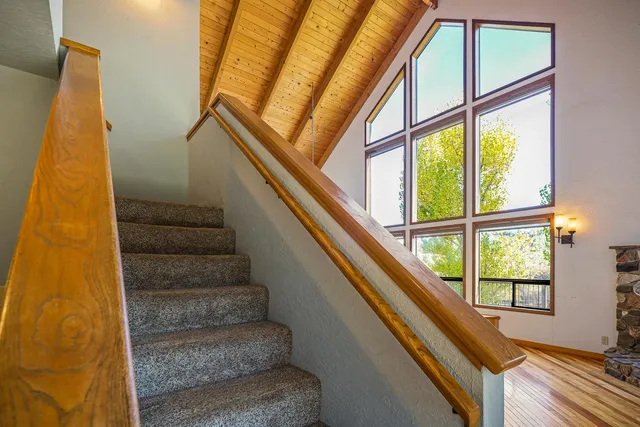 a view of balcony with wooden floor and outdoor seating