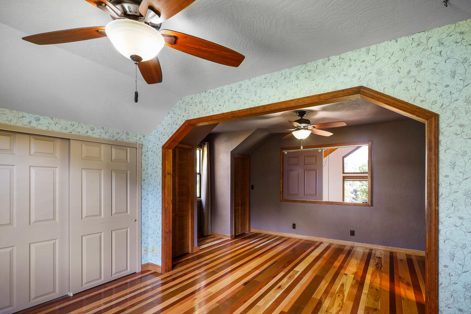 6612 Michel Road Mountain Ranch, CA 95246 - Photo 34 of 78 a view of a room with wooden floor and ceiling fan