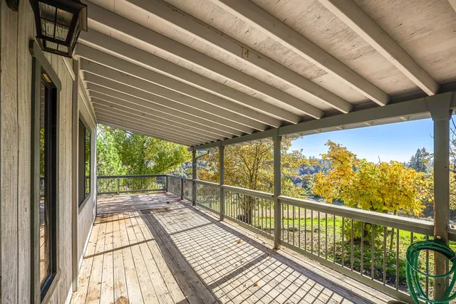 a view of balcony and wooden floor