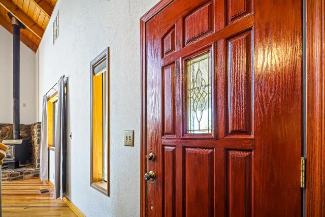 a view of an entryway with wooden floor