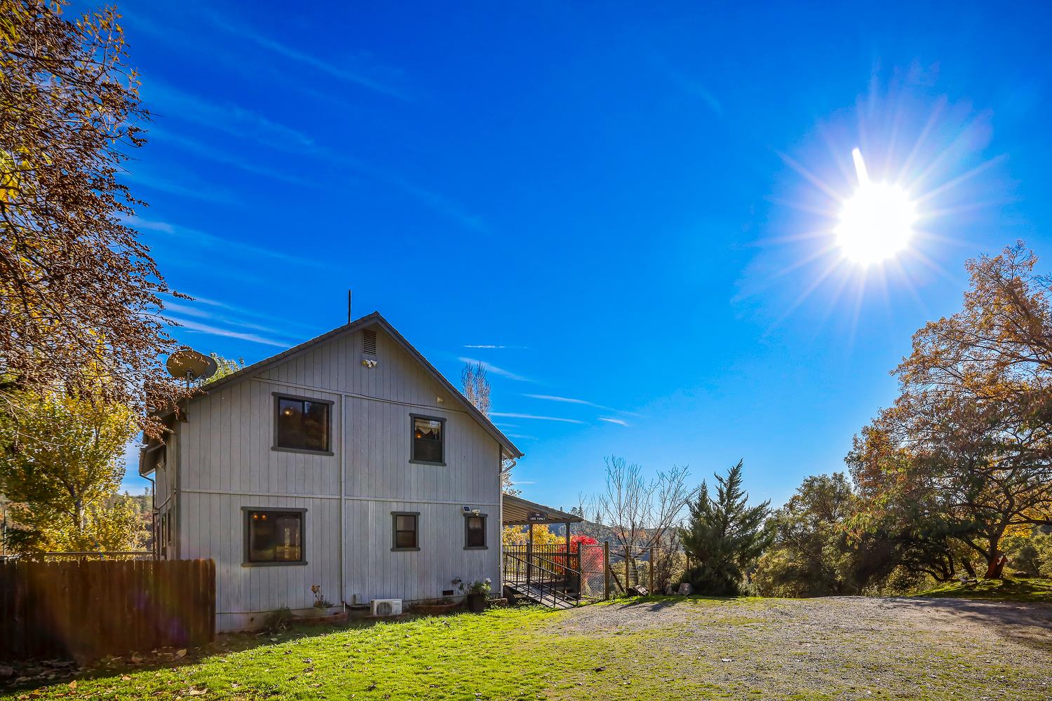 6612 Michel Road Mountain Ranch, CA 95246 - Photo 64 of 78 a front view of a house with a yard