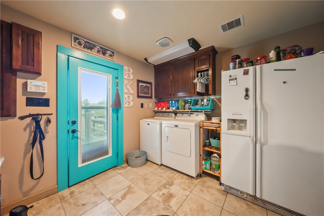 34366 Owens Road Hempstead, TX 77445 - Photo 9 of 31 a kitchen with a refrigerator a sink and dishwasher