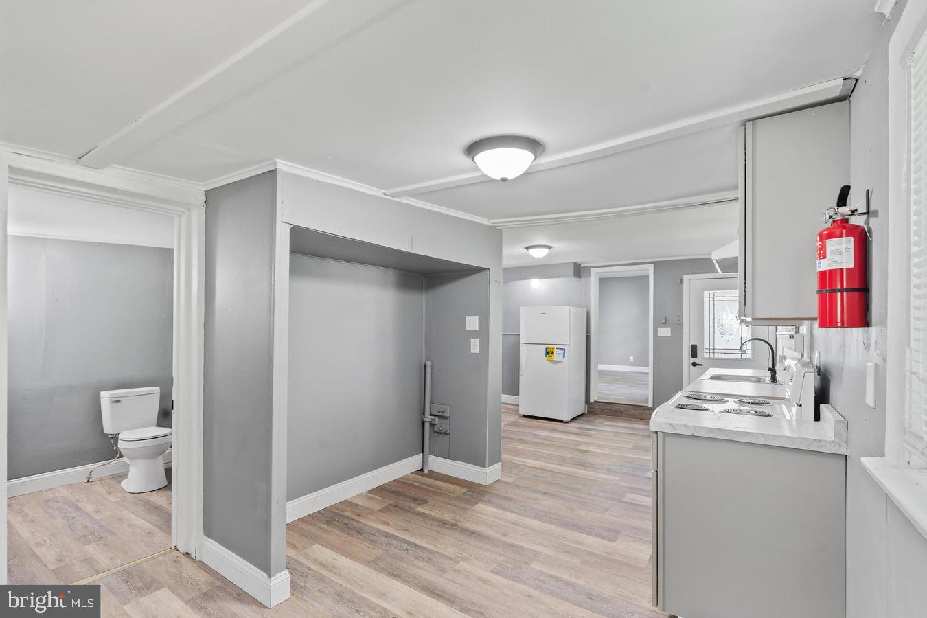 210 Church Street Salem, NJ 08079 - Photo 11 of 35 a very nice looking room with wooden floor and a bathroom