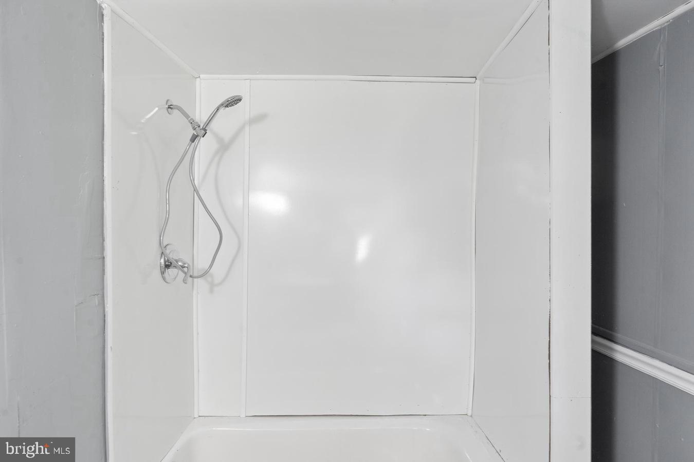 210 Church Street Salem, NJ 08079 - Photo 13 of 35 a bathroom with a glass shower door