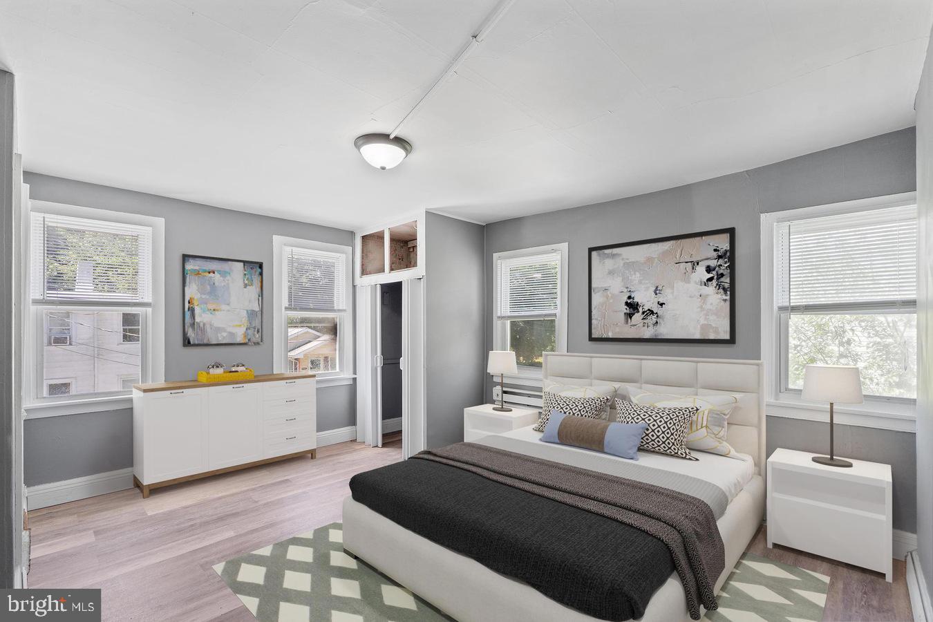 210 Church Street Salem, NJ 08079 - Photo 15 of 35 a bedroom with a large bed and a couch