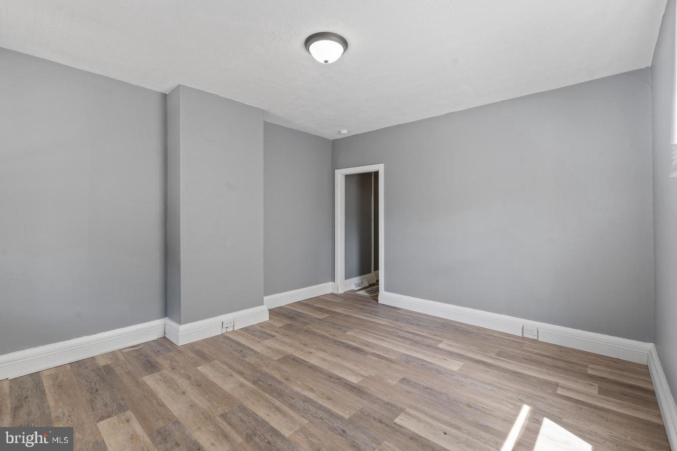 210 Church Street Salem, NJ 08079 - Photo 21 of 35 a view of an empty room with wooden floor