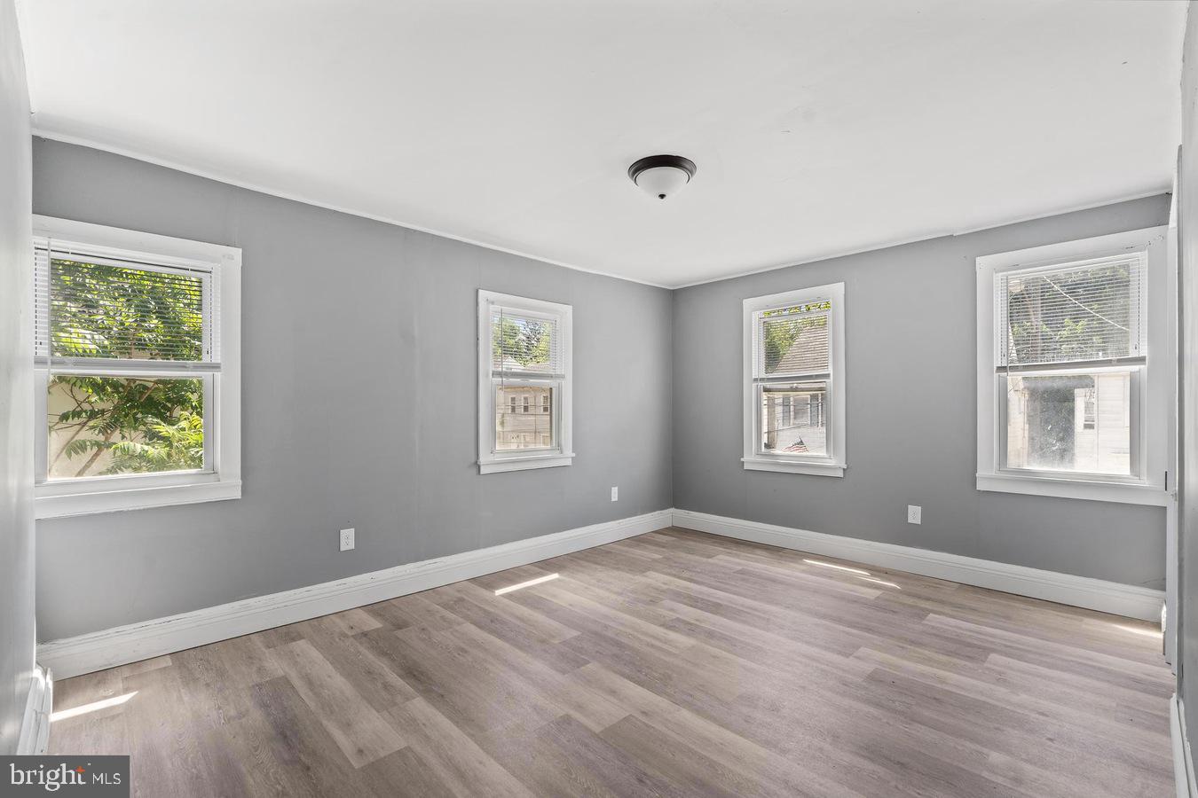 210 Church Street Salem, NJ 08079 - Photo 33 of 35 a view of an empty room with wooden floor and a window
