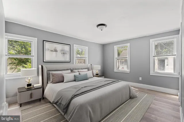 a bedroom with a large bed and a window