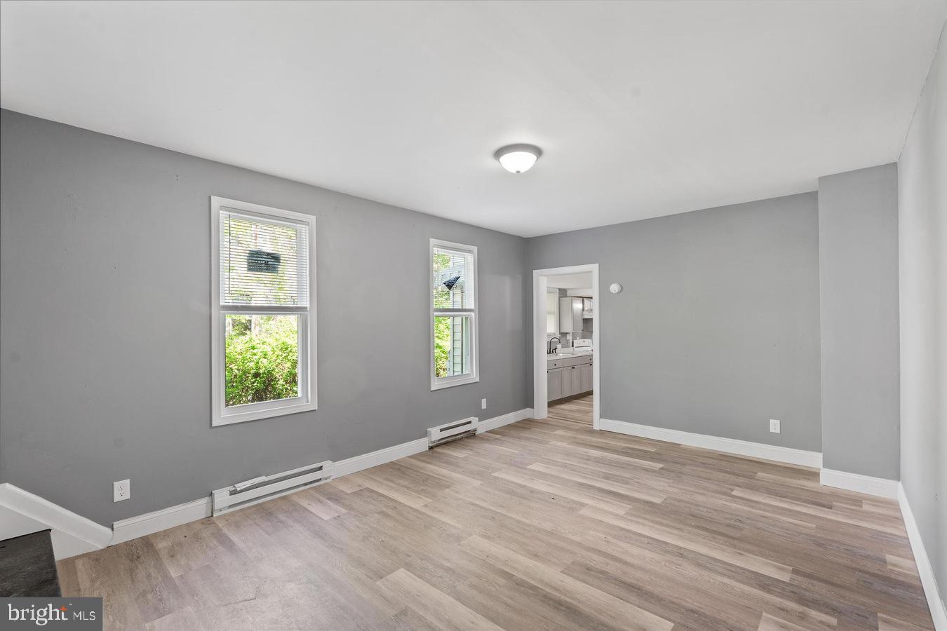 210 Church Street Salem, NJ 08079 - Photo 7 of 35 a view of an empty room with window and wooden floor
