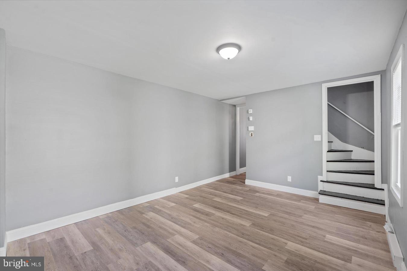 210 Church Street Salem, NJ 08079 - Photo 8 of 35 a view of room with stairs and wooden floor
