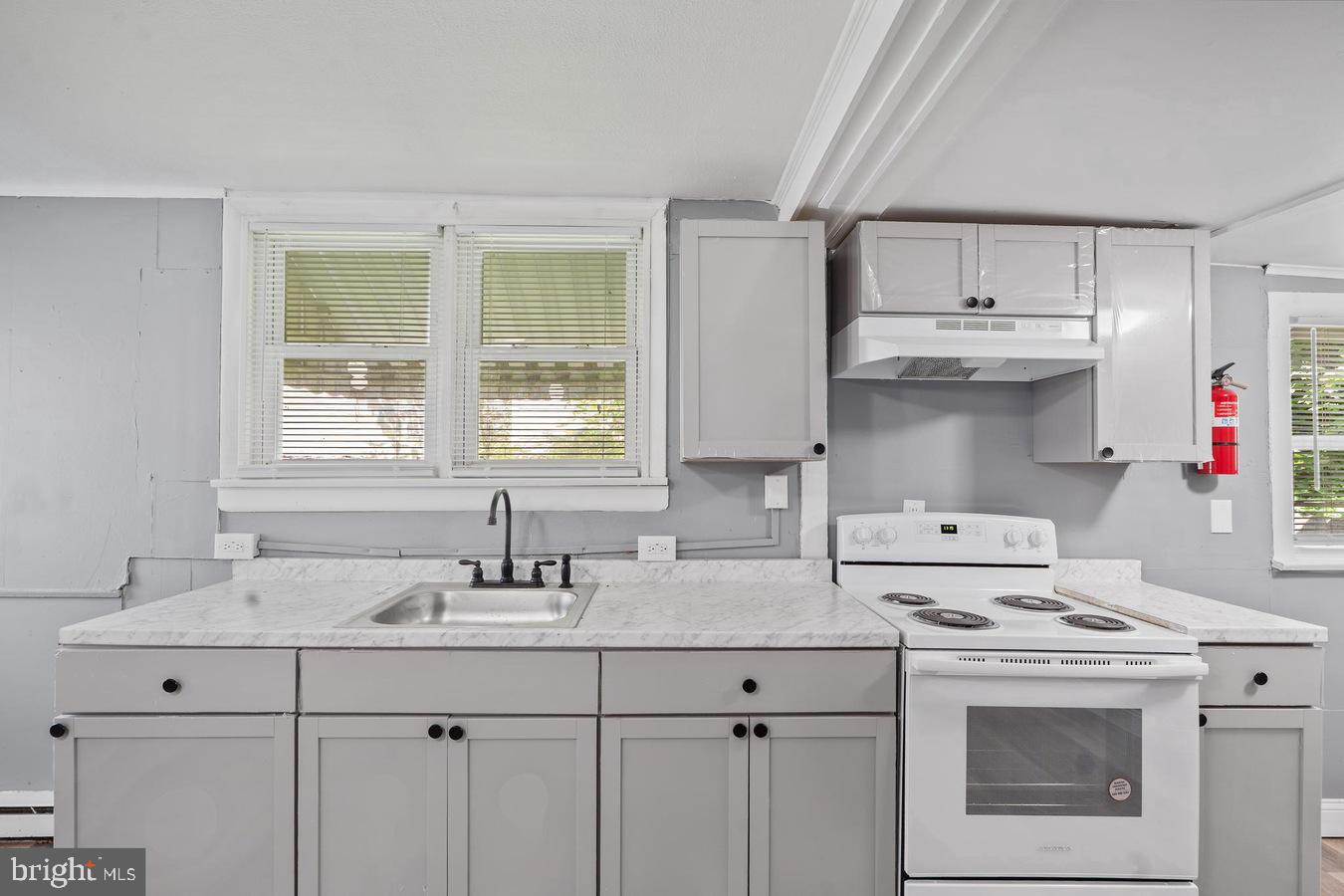 210 Church Street Salem, NJ 08079 - Photo 10 of 35 a kitchen with stainless steel appliances a sink stove and cabinets