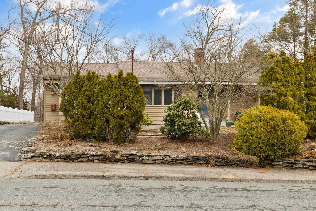 1 Meadowbrook Road Hudson, MA 01749 - Photo 2 of 36 a view of a house with a yard covered in snow