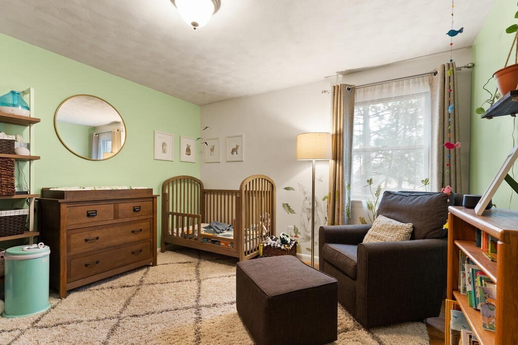 1 Meadowbrook Road Hudson, MA 01749 - Photo 24 of 36 a living room with furniture and a large window